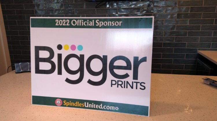 Bigger Prints sponsor sign for Spindles United 2022